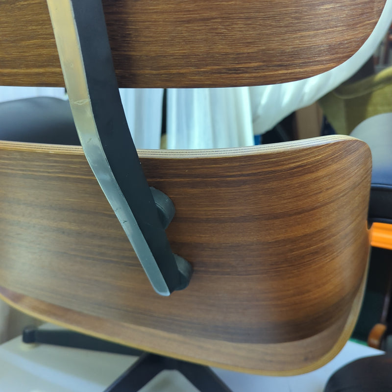 Restoration of pair of original Charles Eames chairs with ottomans
