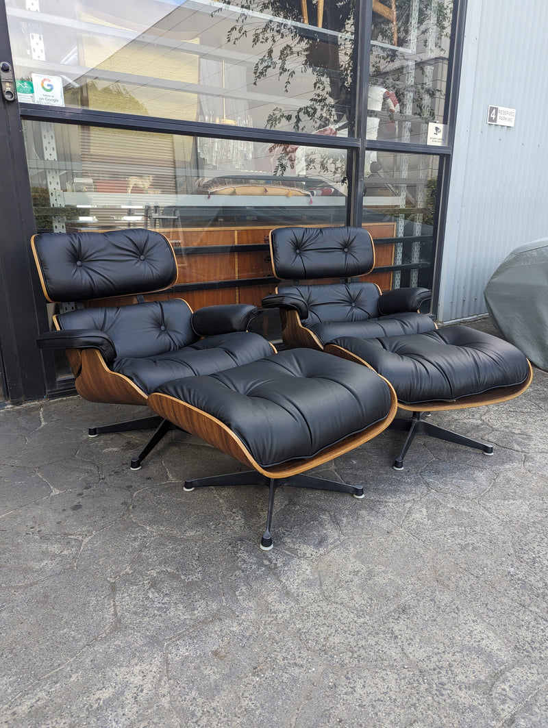 Restoration of pair of original Charles Eames chairs with ottomans