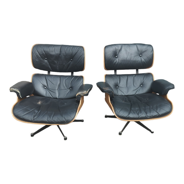 Restoration of pair of original Charles Eames chairs with ottomans