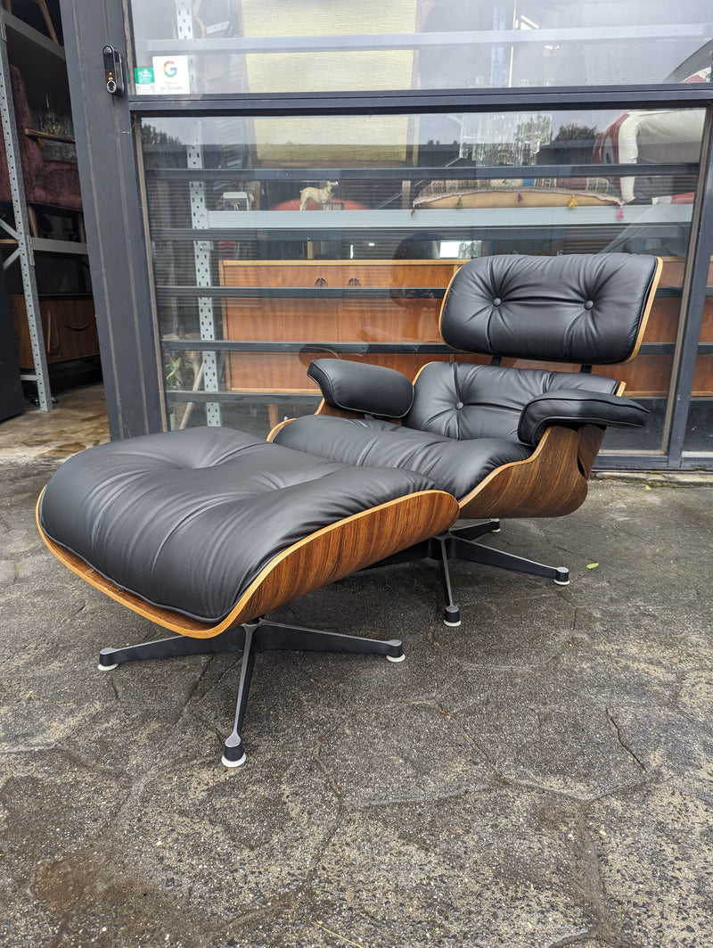 Restoration of pair of original Charles Eames chairs with ottomans