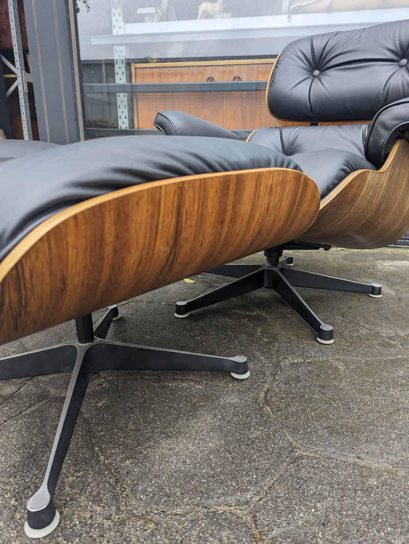 Restoration of pair of original Charles Eames chairs with ottomans