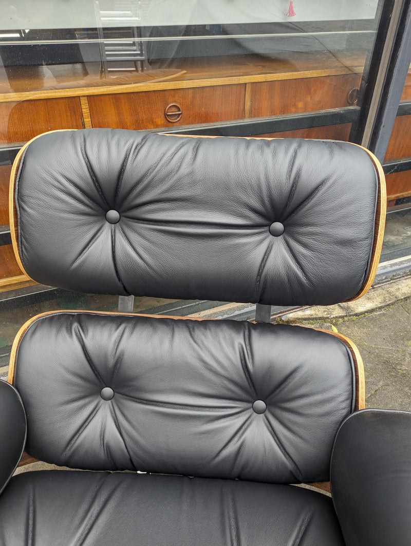 Restoration of pair of original Charles Eames chairs with ottomans