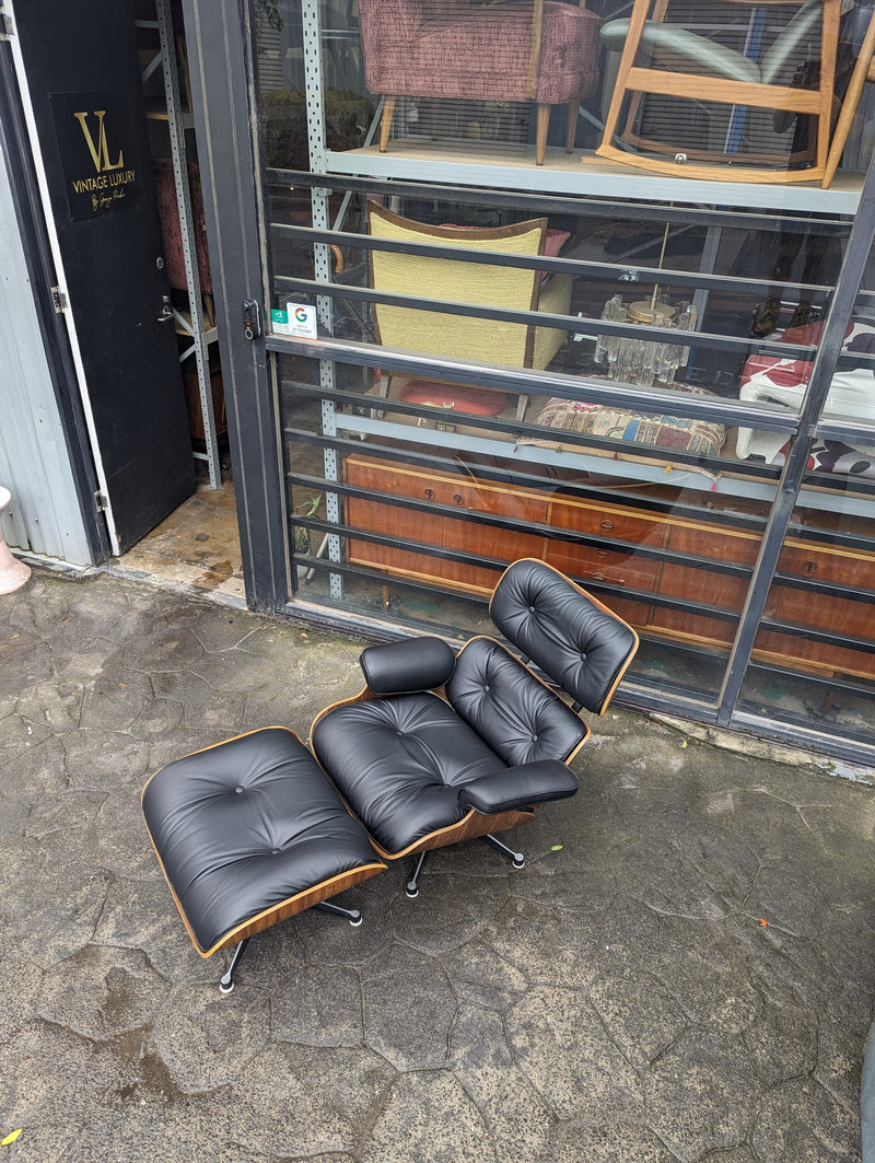 Restoration of pair of original Charles Eames chairs with ottomans