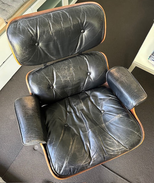Restoration of original Charles Eames pair of armchairs and ottoman original Herman Miller 1970s