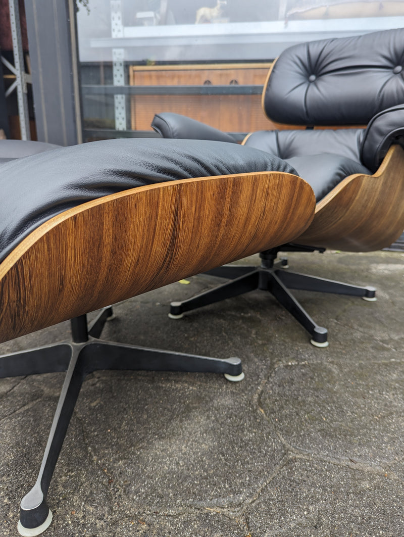 Restoration of pair of original Charles Eames chairs with ottomans