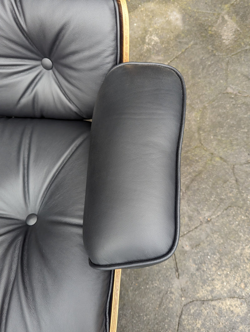 Restoration of pair of original Charles Eames chairs with ottomans
