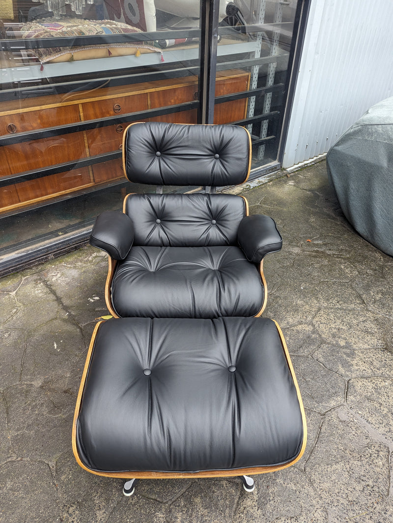 Restoration of pair of original Charles Eames chairs with ottomans