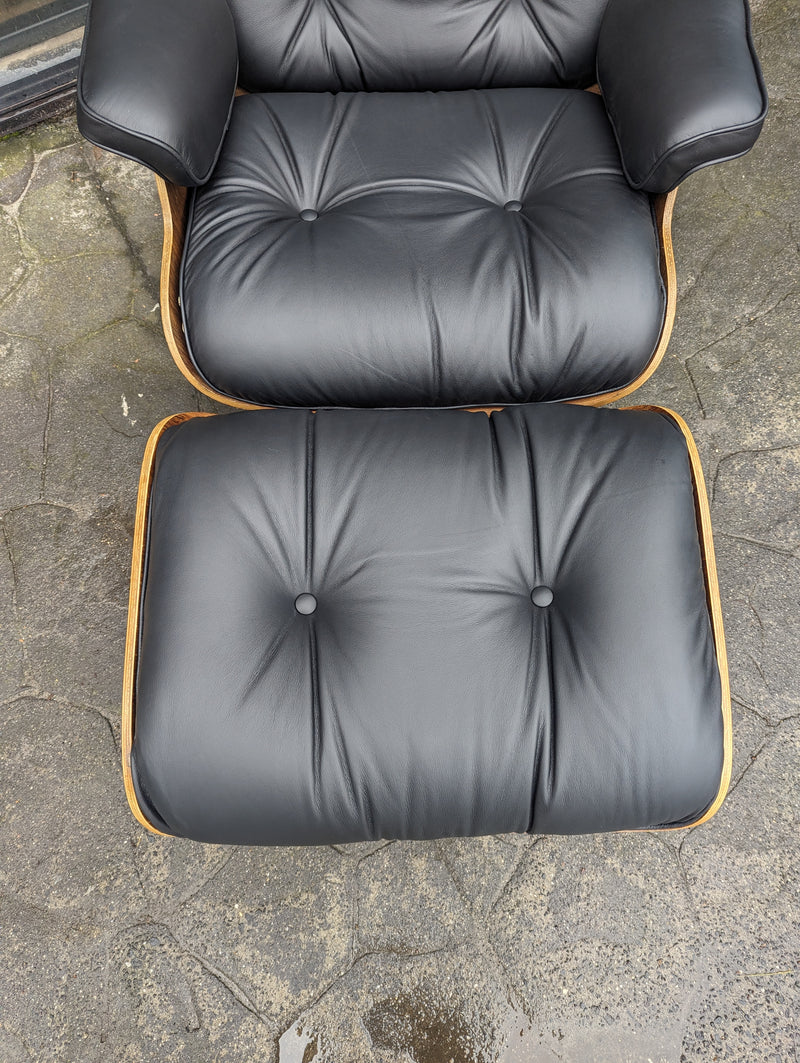 Restoration of pair of original Charles Eames chairs with ottomans