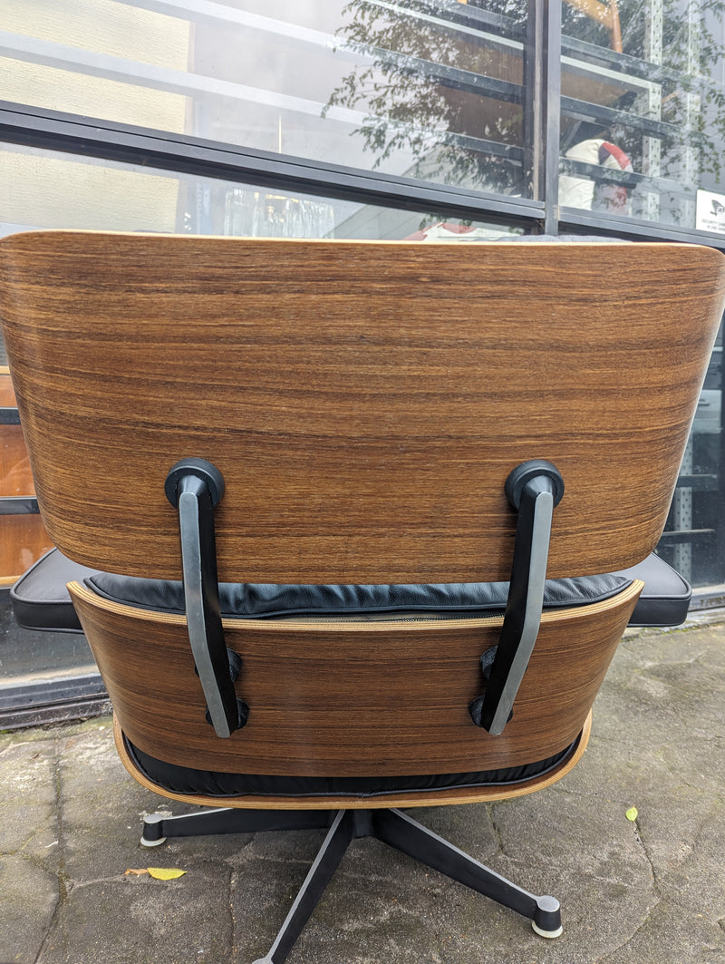 Restoration of pair of original Charles Eames chairs with ottomans