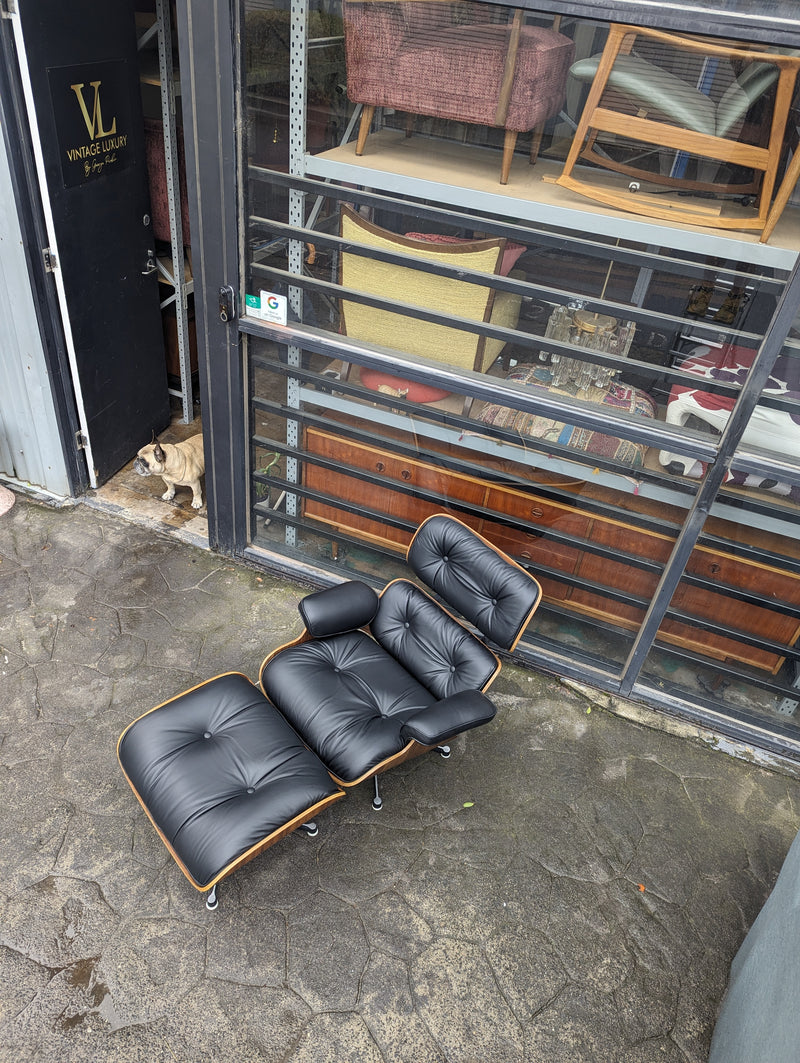 Restoration of pair of original Charles Eames chairs with ottomans