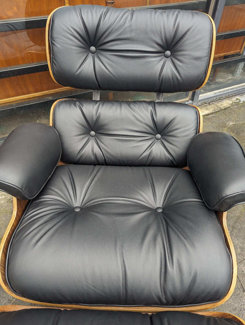 Restoration of pair of original Charles Eames chairs with ottomans